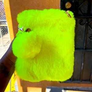 Small fluffy purse w/detachable gold chain strap.